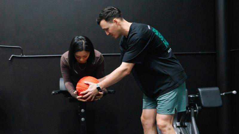 Experienced lifter training with a coach at Habitat Gym, a private gym in Prestons