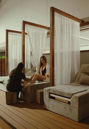 Client receiving foot massage at bathhouse