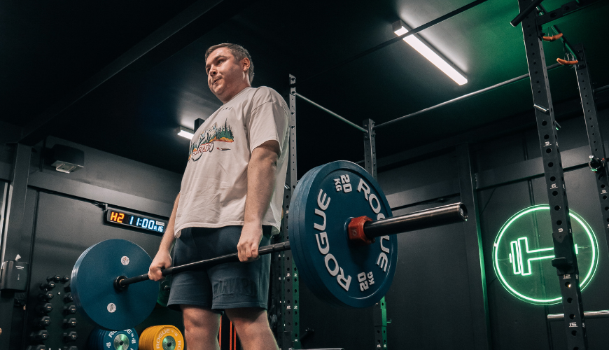 Man deadlifting at Habitat Gym during his workout session